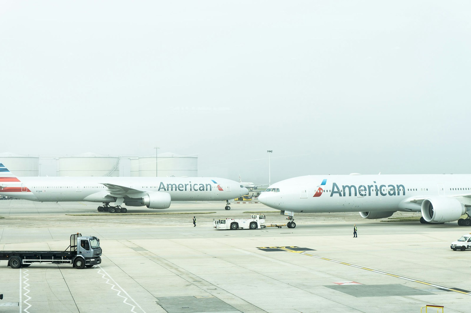 Photo by Damian Hutter two American Airlines planes on airport